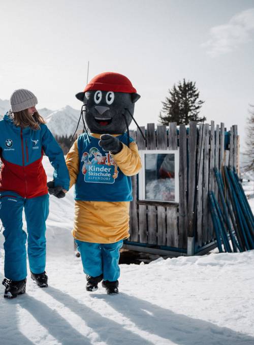 A family enjoys their ski holiday in the Snow Space Salzburg ski area in Austria.