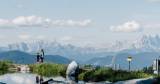 A family hiking around the mountain lake at Geisterberg in St. Johann in Salzburg