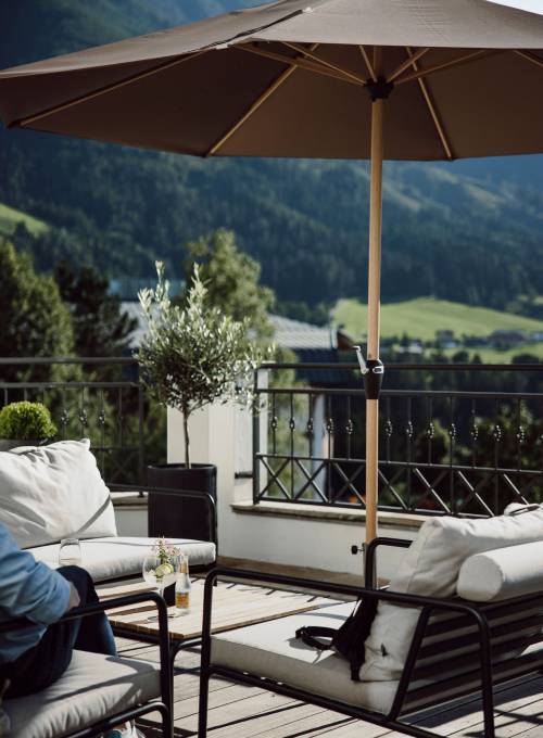 A beautiful sun Terrace at the Hotel Alpina Alpendorf with panoramic view. 
